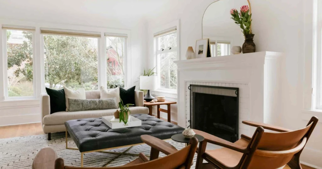 Dining Room With Fireplace and Large Mirror Above Mantel