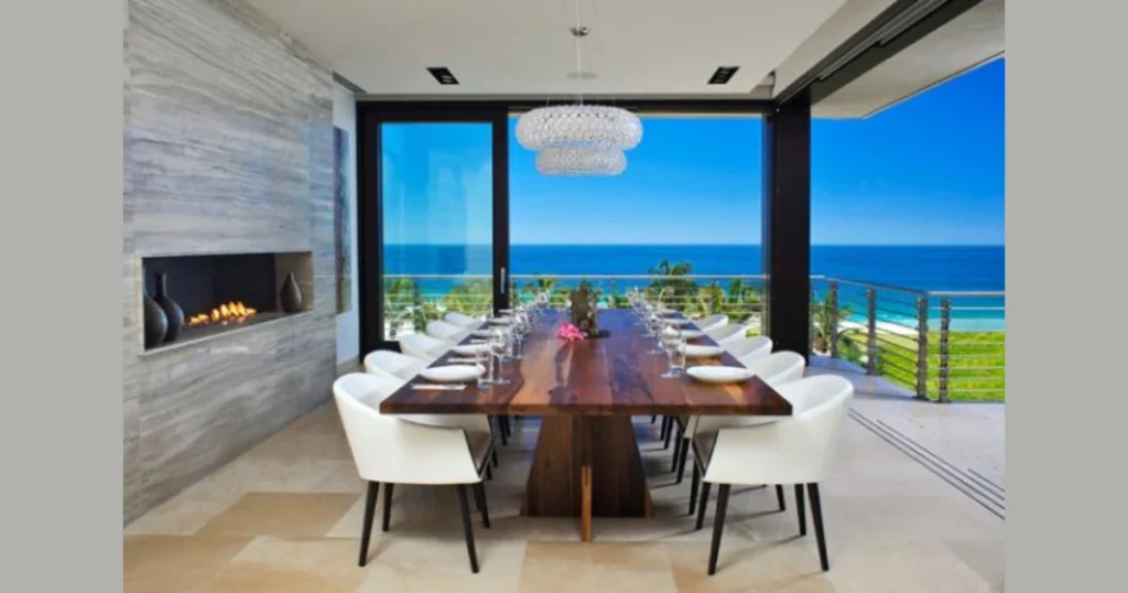 Farmhouse Dining Room With a Stone Fireplace