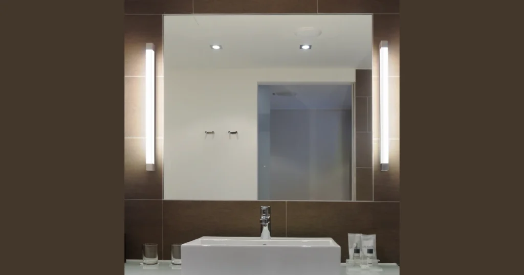 Side Column Light Fixtures Along Mirror Edges