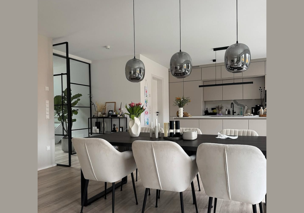 Black Dining Table With Statement Lighting