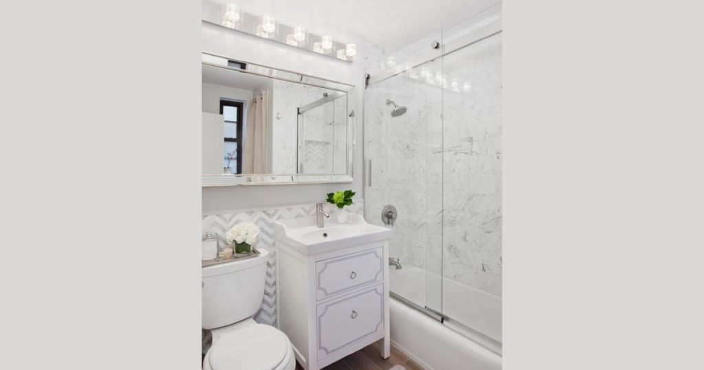 Small White Bathroom with Large Mirrors